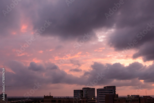 Dramatic colorful pink and purple sunset clouds Photo taken of a sky in San Antonio Texas during twilight