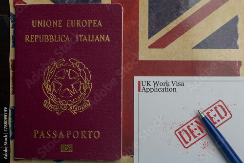 UK work visa concept: italian passport next to a denied work visa