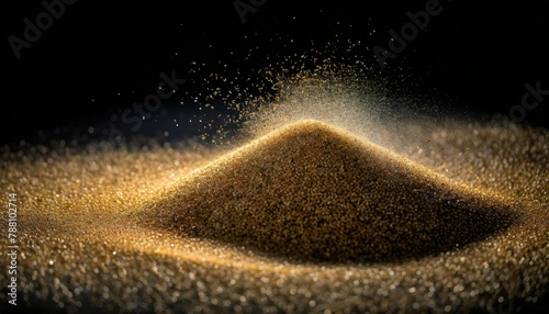 isolated sand grains on a black background  arranged in a dynamic pattern to evoke movement and depth