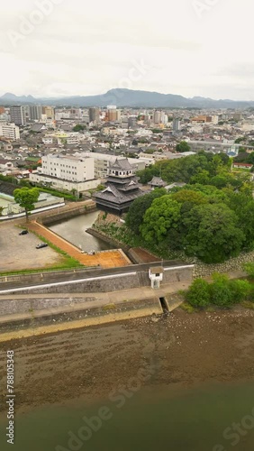 Aerial view of Nakatsu Castle with river and traditional Japanese architecture, Nakatsu, Japan. photo