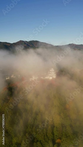 Aerial view of Gujo Hachiman Castle in misty morning, Gifu, Japan. photo