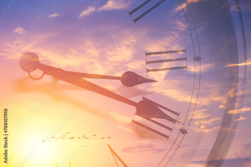 Fototapeta premium Clock face memory time in sun bright sky. Time passing sunset or sunrise sky overlay