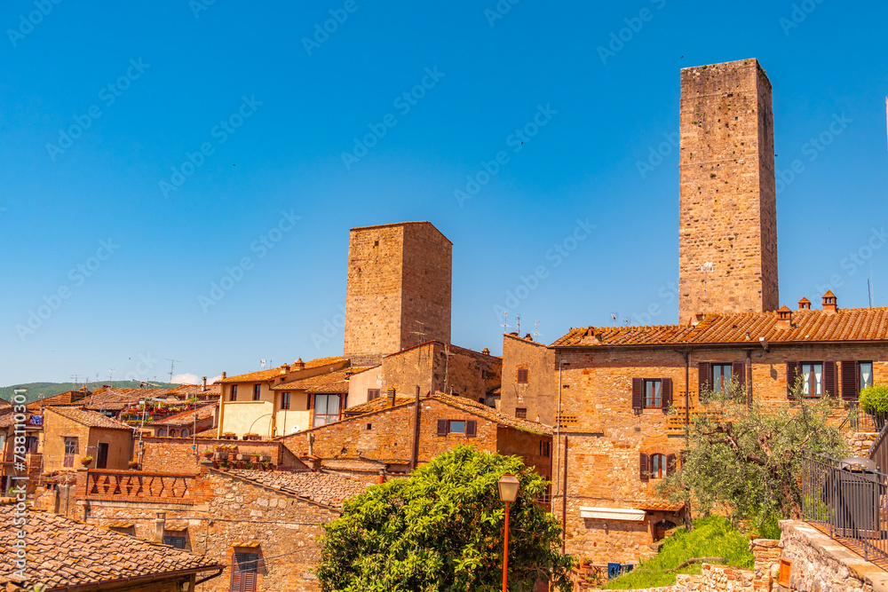 Fototapeta premium Medieval San Gimignano hill town with skyline of medieval towers, including the stone Torre Grossa. Province of Siena, Tuscany, Italy.