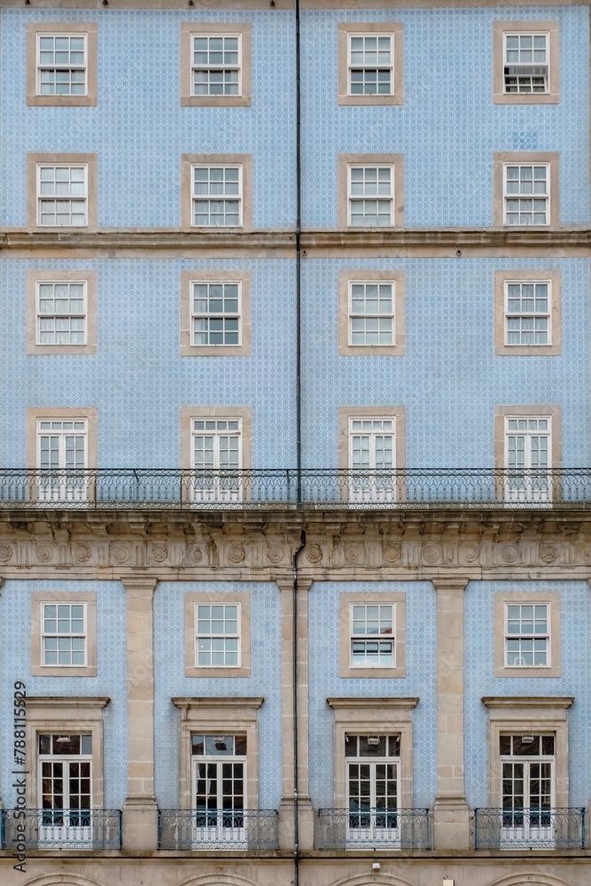 Typical facade of the buildings of the beautiful city of Porto, Portugal. With its typical tiles of Portugal, its windows, balconies and hanging clothes. Next to the Douro river.