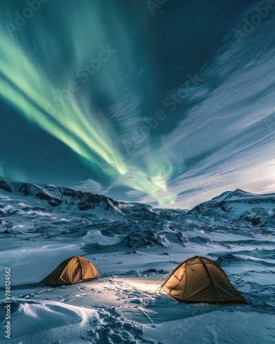 Tents on the snow under the Northern lights