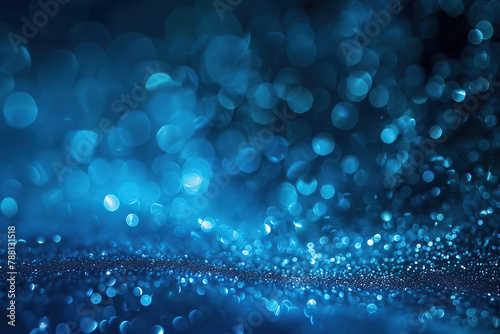 horizontal image of blue glowing glitters abstract background