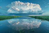 An image of a supercell reflected in a large lake, doubling the visual impact of the storm in the st