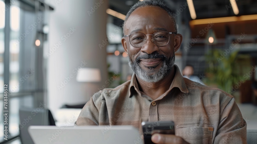 Smiling Man with Smartphone and Laptop Smiling Man with Smartphone and Laptop