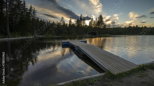 Wooden Dock on Calm Lake with Trees in Background