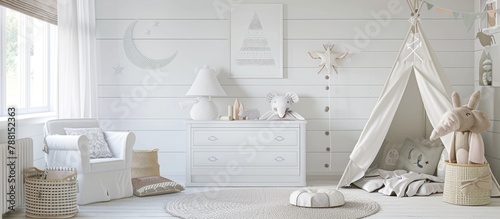 A child's room decorated with white furniture, a carpet, a tent, and a wall sticker.