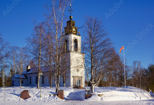 Church of Idre with snow and blue sky