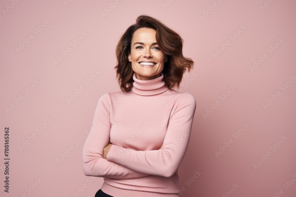 Portrait of a glad woman in her 40s wearing a classic turtleneck sweater over pastel or soft colors background Portrait of a glad woman in her 40s wearing a classic turtleneck sweater over pastel or soft colors background
