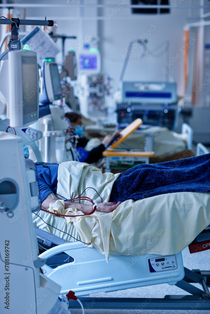 Patient in the ICU in a hospital with surgery equipment. Patient in the ICU in a hospital with surgery equipment.