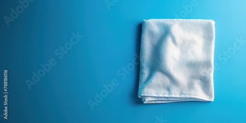 White towel on a blue background with copy space. photo