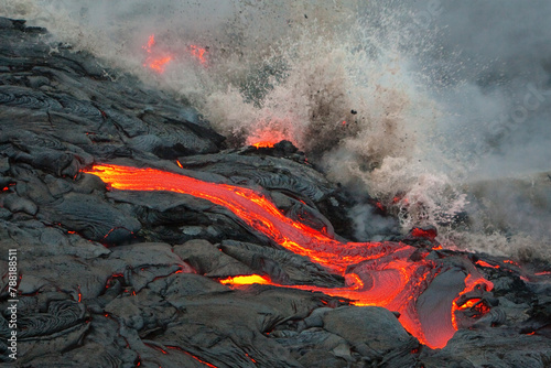 View of volcanic eruption with lava flow and smoke, Big Island, Hawaii, United States.