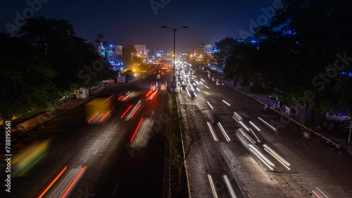 Timelapse of busy roads with traffic and light trails of New Delhi, India