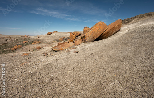 Large round broken red concretion on a hillside at Red Rock Coulee near Seven Persons, Alberta, Canada