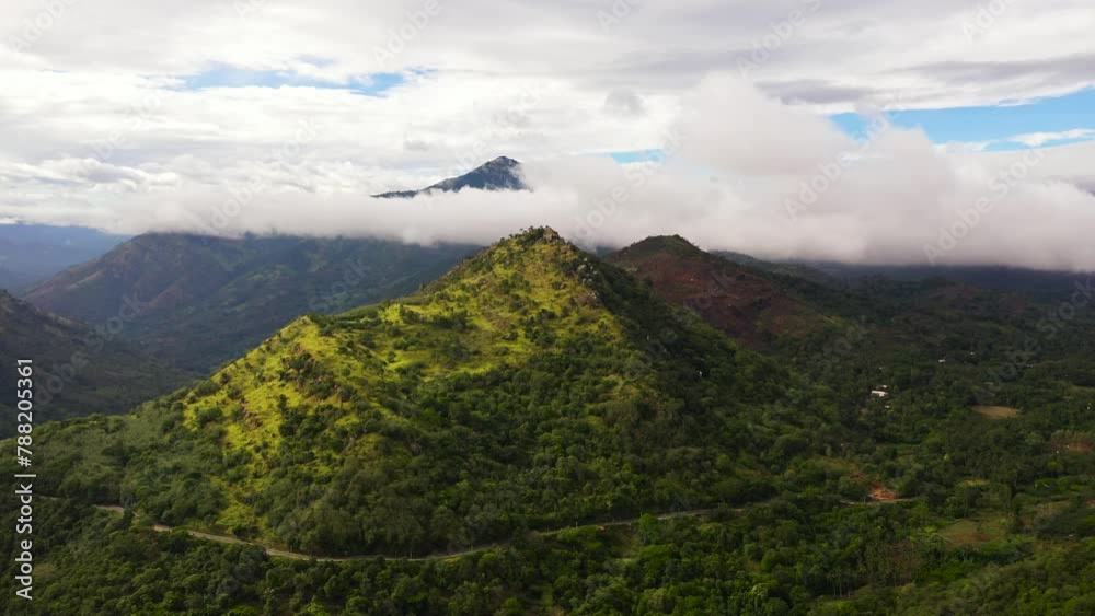 Top view of Mountains covered rainforest, trees and blue sky with clouds. Sri Lanka. Top view of Mountains covered rainforest, trees and blue sky with clouds. Sri Lanka.