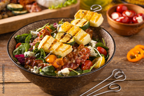 Delicious salad added to grilled dishes, with bacon and halloumi cheese.