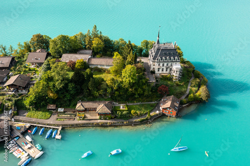 Iseltwald village on a peninsula in lake Brienz in the alps in Canton Bern in Switzerland.
