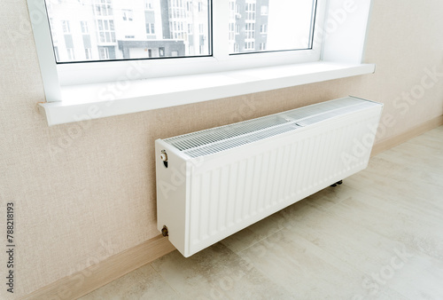 Wallpaper Mural The radiator of the battery hangs on the wall under the window. Torontodigital.ca