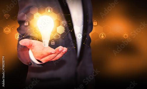 Innovation in futuristic technology concept with glowing Bulb representing new ideas, background. Modern and innovative ideas generation backdrop with bulb hovering above person's hand