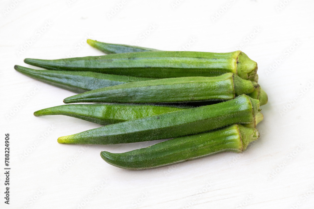 Fresh green okra isolated on white background. Healthy vegetables. Fresh green okra isolated on white background. Healthy vegetables.