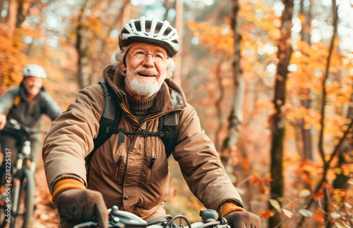 Active senior man enjoying nature outdoors riding bike. Mature man on bike trail in forest. Concept of activity in nature for seniors with a mountain bike. © Victor