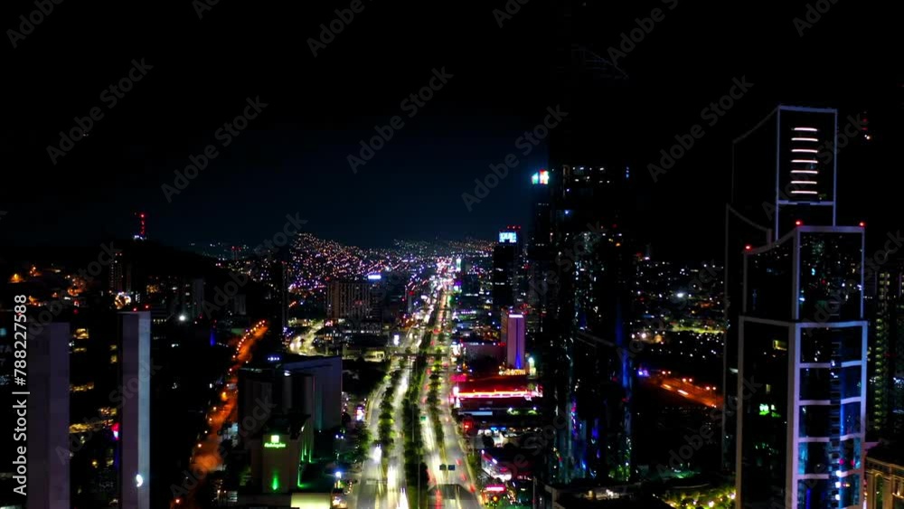 Aerial Forward Time Lapse Shot Of Traffic On Illuminated Streets In City Against Sky At Night - Monterrey, Mexico Aerial Forward Time Lapse Shot Of Traffic On Illuminated Streets In City Against Sky At Night - Monterrey, Mexico
