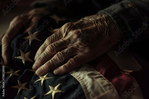 senior man grasping an american flag