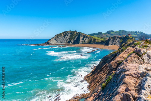 View of Itzurun beach from Cala de Algorri in the Flysch Basque Coast geopark in Zumaia, Gipuzkoa photo