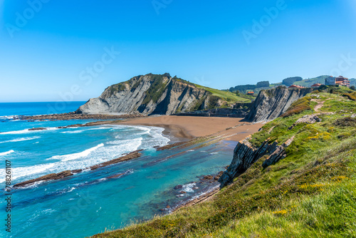 Fototapeta Naklejka Na Ścianę i Meble -  Beautiful Itzurun beach from Cala de Algorri in the Flysch Basque Coast geopark in Zumaia, Gipuzkoa