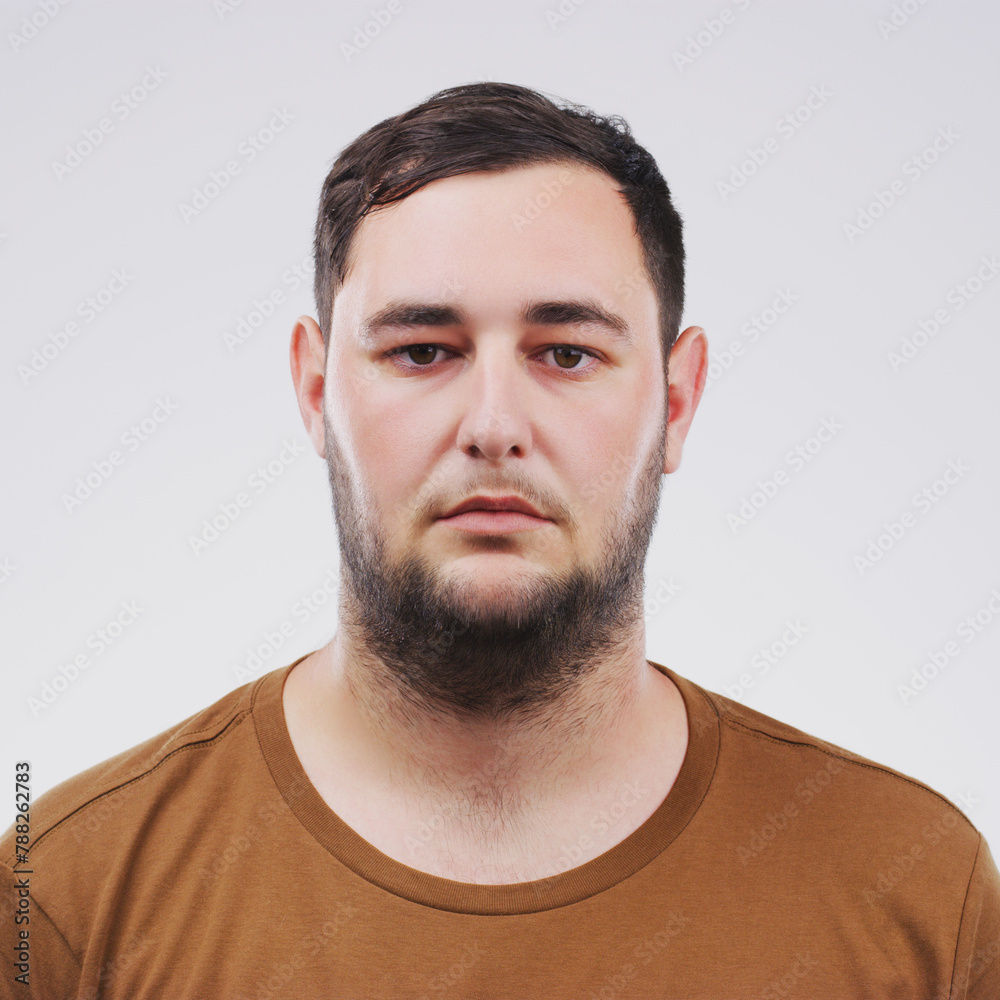 Fototapeta premium Portrait, mugshot and man in studio for arrest, political activism or human rights with white background. Activist, serious and face of male person for Ukraine conflict, justice or stop war in Russia