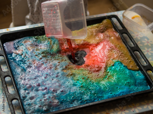 a child makes experiments with chemicals. experiments with soda and citric acid