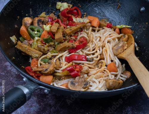 Vegan stir fry in wok- seitan and mixed veggies