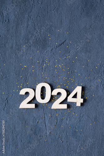 Class of 2024 number with graduation cap on dark background. Graduation holiday concept © Alina