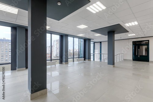 panorama view in empty modern hall with columns  doors  stairs and panoramic windows