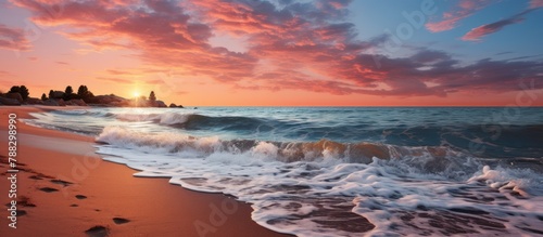 panoramic view of the beach at dusk  with the sunset orange sun