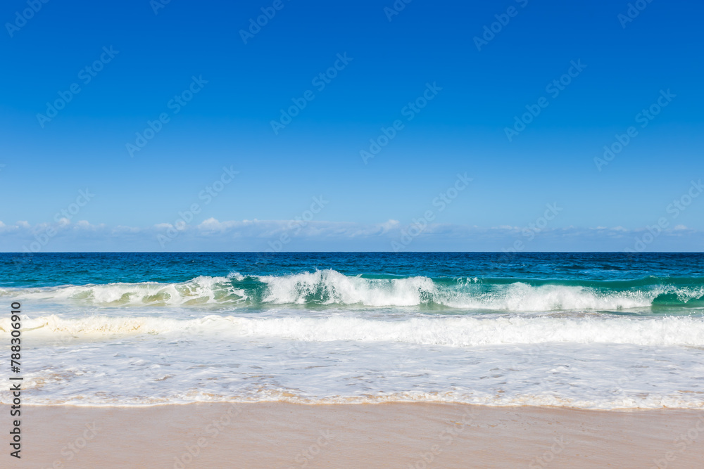 Ocean Waves at Sand Beach of Shoal Bay, New South Wales, Australia.