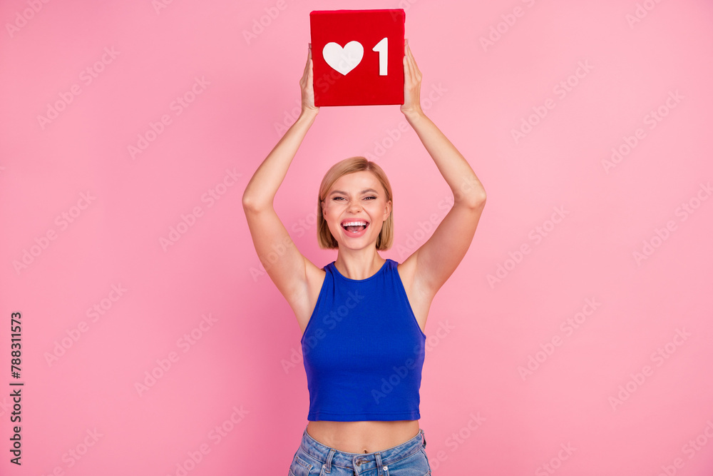 Photo of pretty young woman hands hold like icon wear blue top isolated on pink color background - obrazy, fototapety, plakaty 