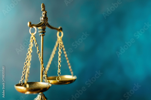 Golden Scales of Justice on a Blue Background Symbolizing Law and Balance