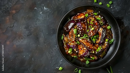 Hot spicy stew eggplant in Korean style with green onion. Aubergine saute. Vegan food. Top view  photo