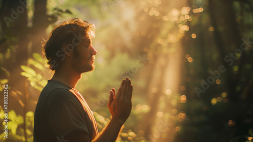 A man in deep prayer in a lush forest, with sunlight creating an almost visible presence of God in the background. , natural light, soft shadows, with copy space
