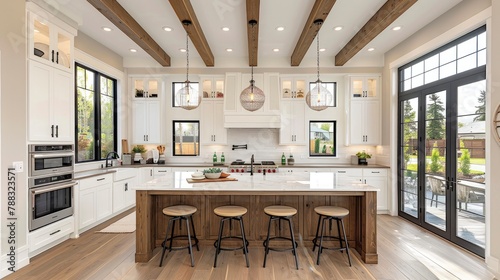 traditional kitchen in beautiful new luxury home with hardwood floors wood beams and large island quartz counters includes farmhouse sink elegant pendant lights and large windowsimage