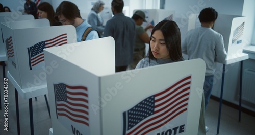 Asian woman comes to vote in booth in polling station office. National Election Day in the United States. Political races of US presidential candidates. Concept of civic duty. Slow motion. Dolly shot.