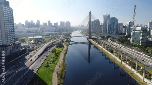 Aerial view of Octavio Frias de Oliveira Bridge - Ponte Estaiada - over Pinheiros River, Sao Paulo, Brazil This image is perfect for projects related to events, travel and tourism.	
 photo