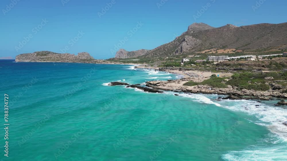 Aerial drone video of Falassarna beach, Crete, Greece. North West Crete island. Top view video of famous paradise golden sandy deep turquoise beach. Aerial drone video of Falassarna beach, Crete, Greece. North West Crete island. Top view video of famous paradise golden sandy deep turquoise beach.
