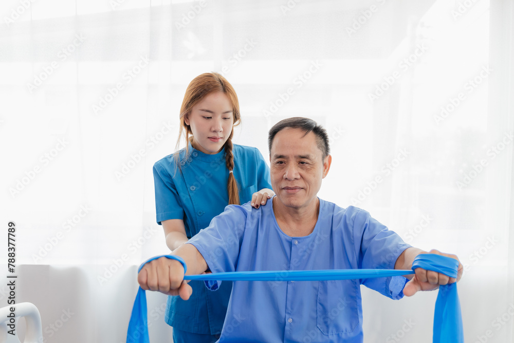 Physical therapy assistance Asian female doctor with senior man in physical therapy rehabilitation or health support Female physical therapist or physical therapist counseling an elderly patient.