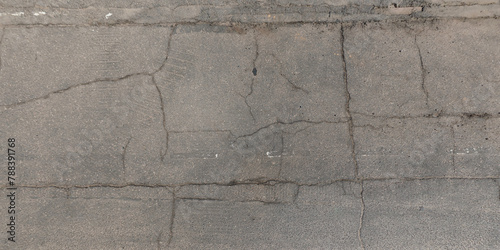 view from above on texture of asphalt road with cracks