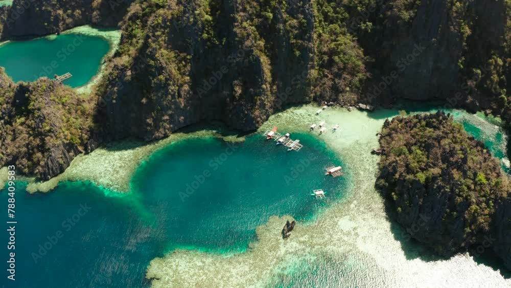 Aerial drone lagoons and coves with blue water among the rocks. lagoon, mountains covered with forests. Seascape, tropical landscape. Palawan, Philippines, Busuanga Aerial drone lagoons and coves with blue water among the rocks. lagoon, mountains covered with forests. Seascape, tropical landscape. Palawan, Philippines, Busuanga